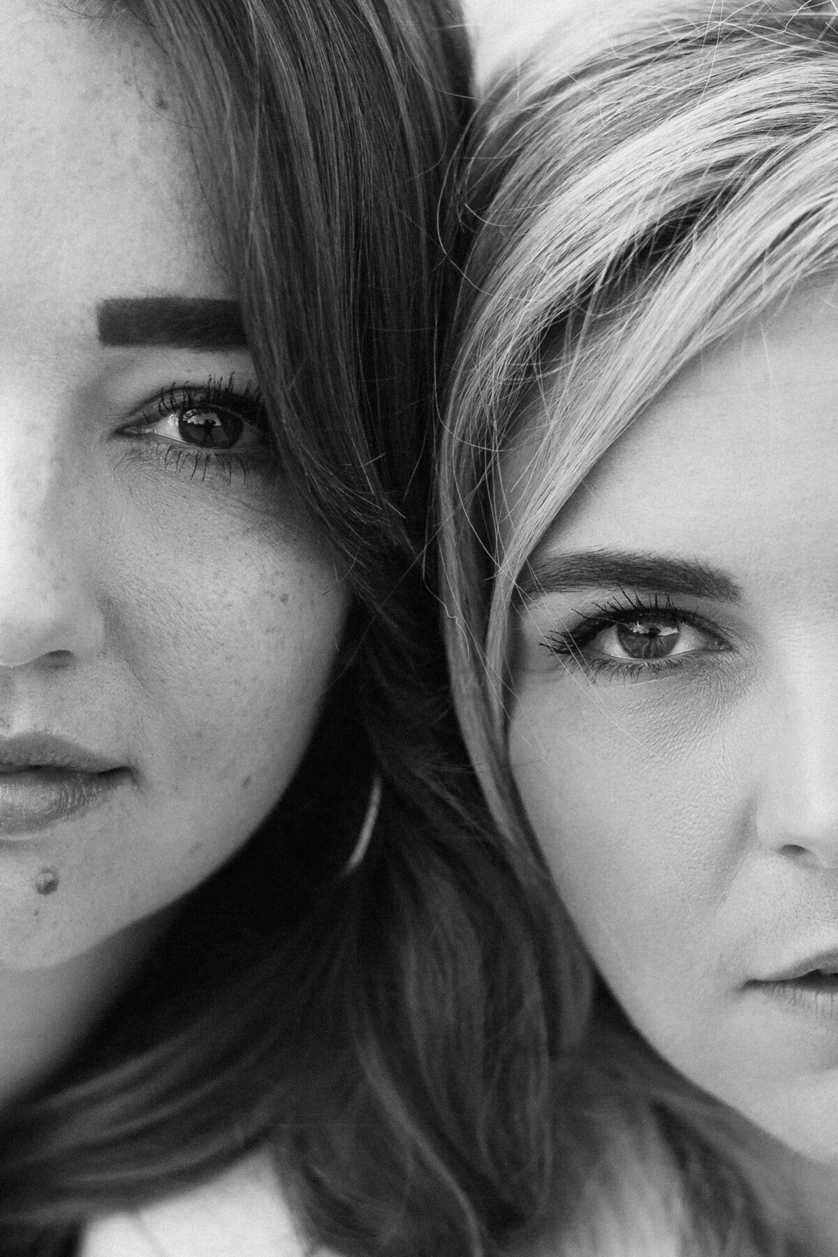 Close up of the faces of two women in black and white for a personal branding photoshoot