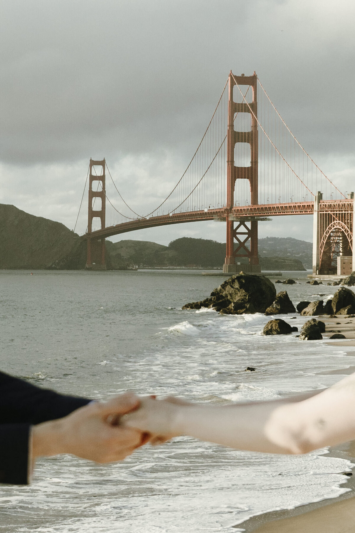 Bride and Groom at Marshall's Beach in San Francisco, California at sunset