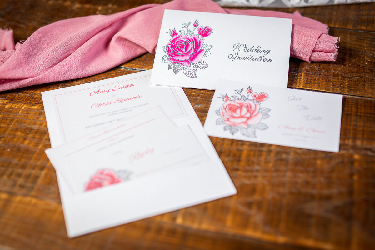 Elegant embossed and watercolour rose design  on bespoke wedding stationery suite
