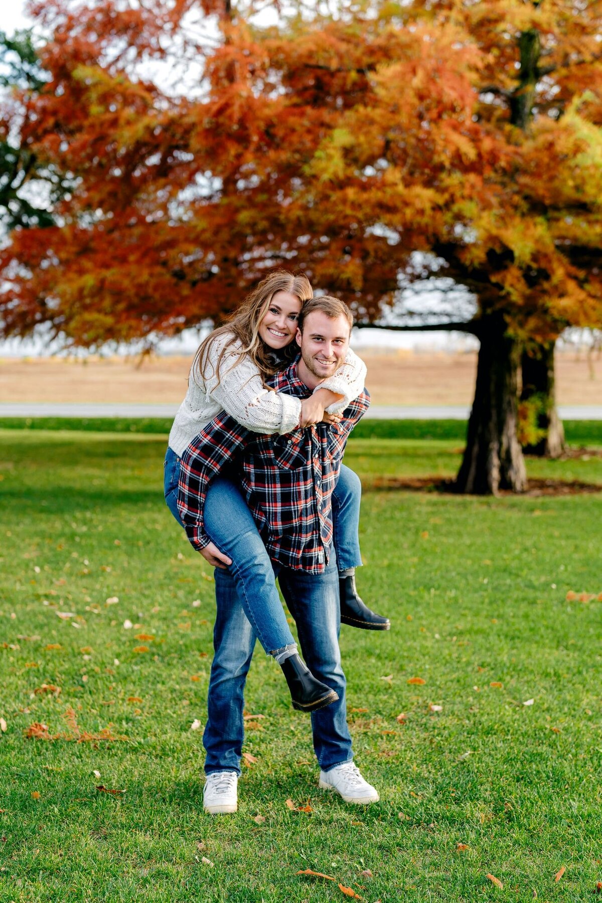 girl-on-mans-back-engagement-session