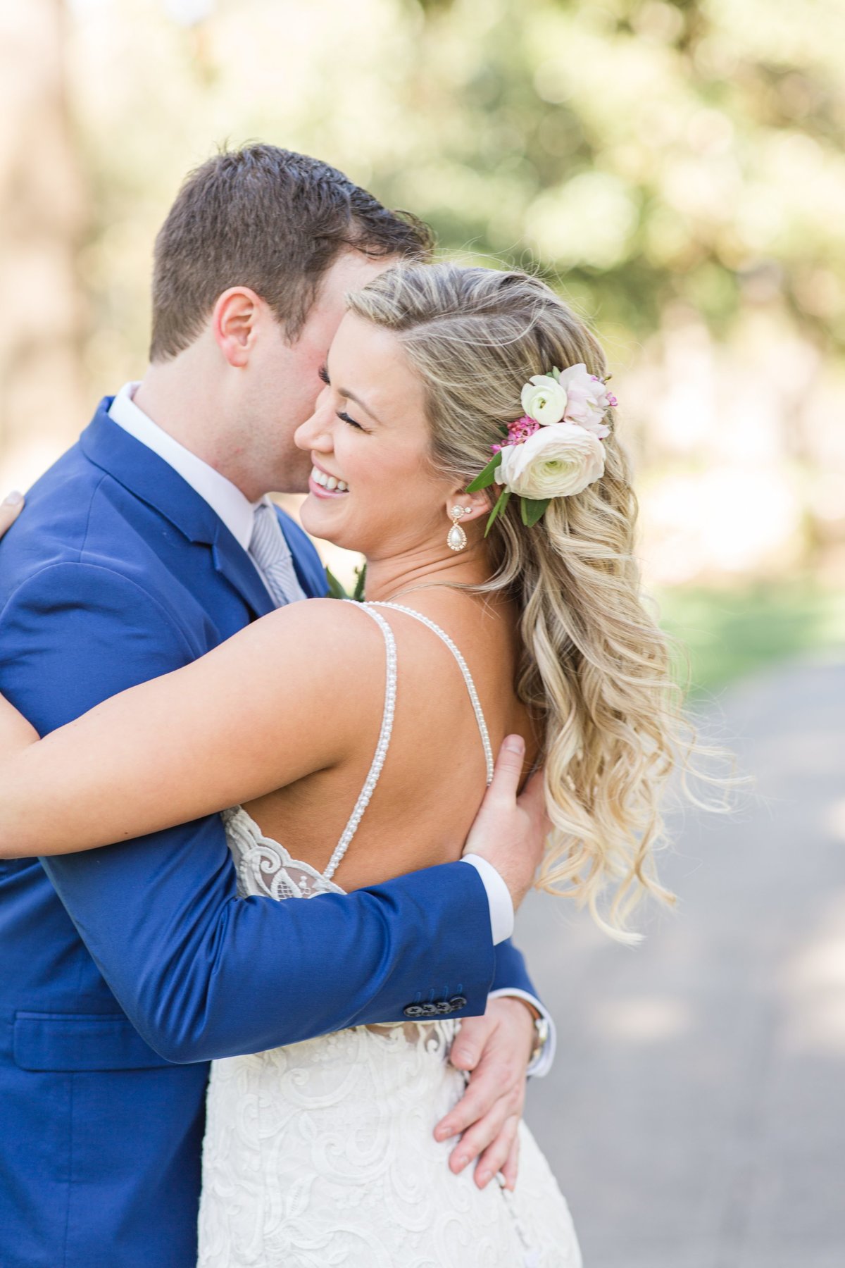 bride and groom embracing in forsyth park