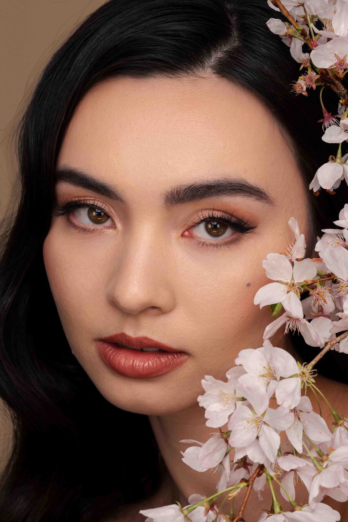 model posing with cherry blossom