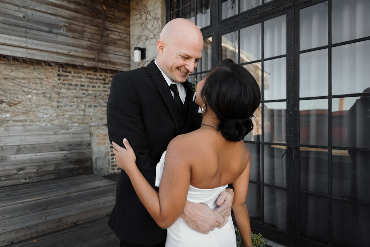 groom is so happy after he sees his bride for the first time and they embrace