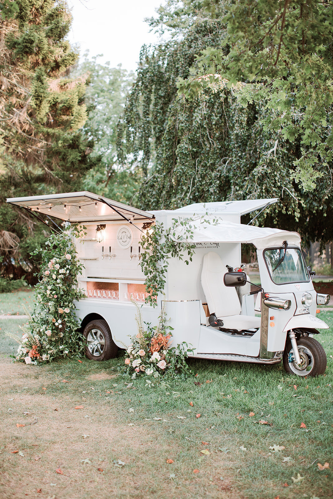 Moped style mobile bar decorated with florals