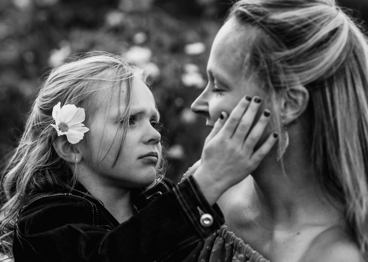 Capturing a tender moment between mother and daughter in a photo, taken by a Pittsburgh family photographer.