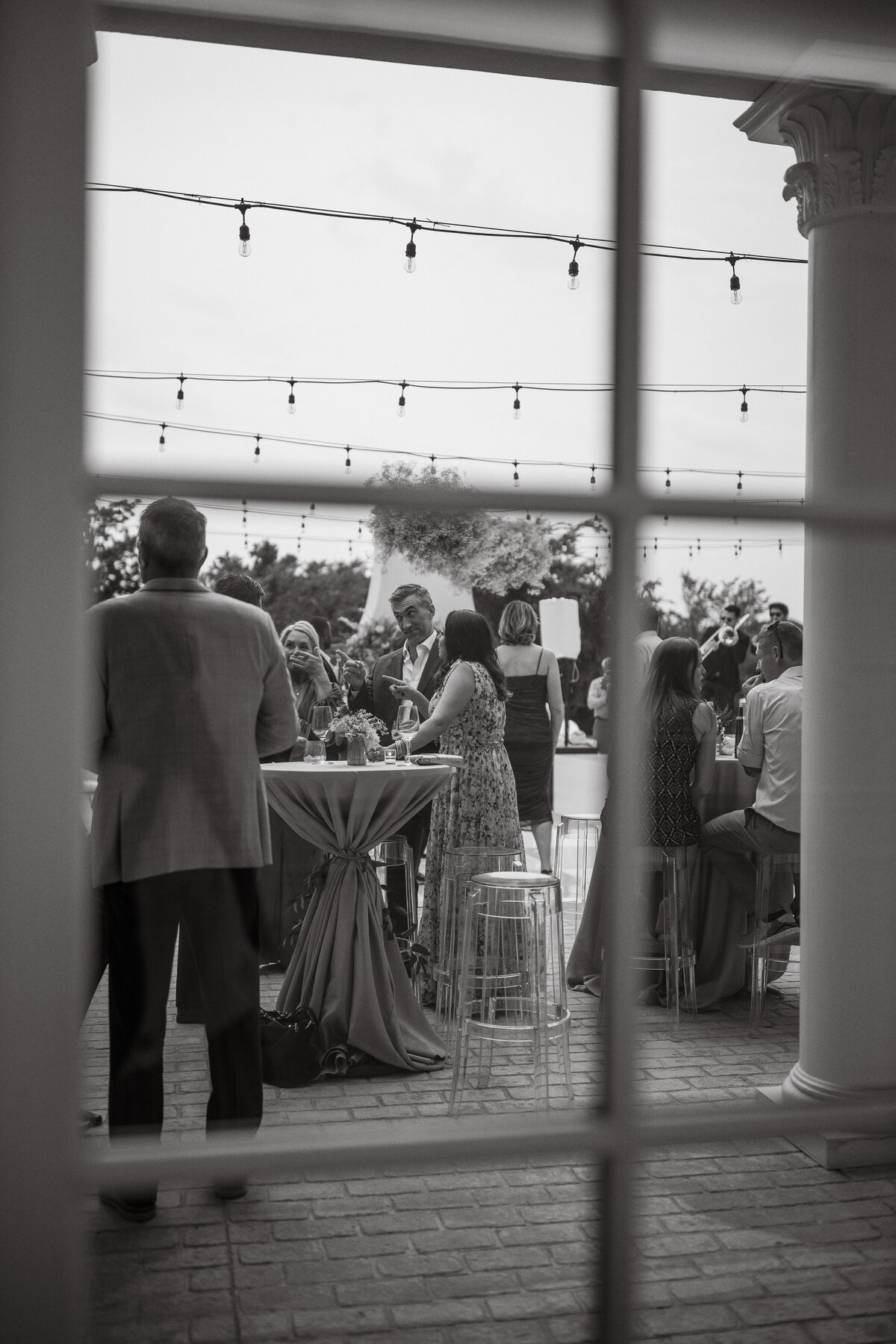 Wedding Photographer & Videographer, view of reception through a window