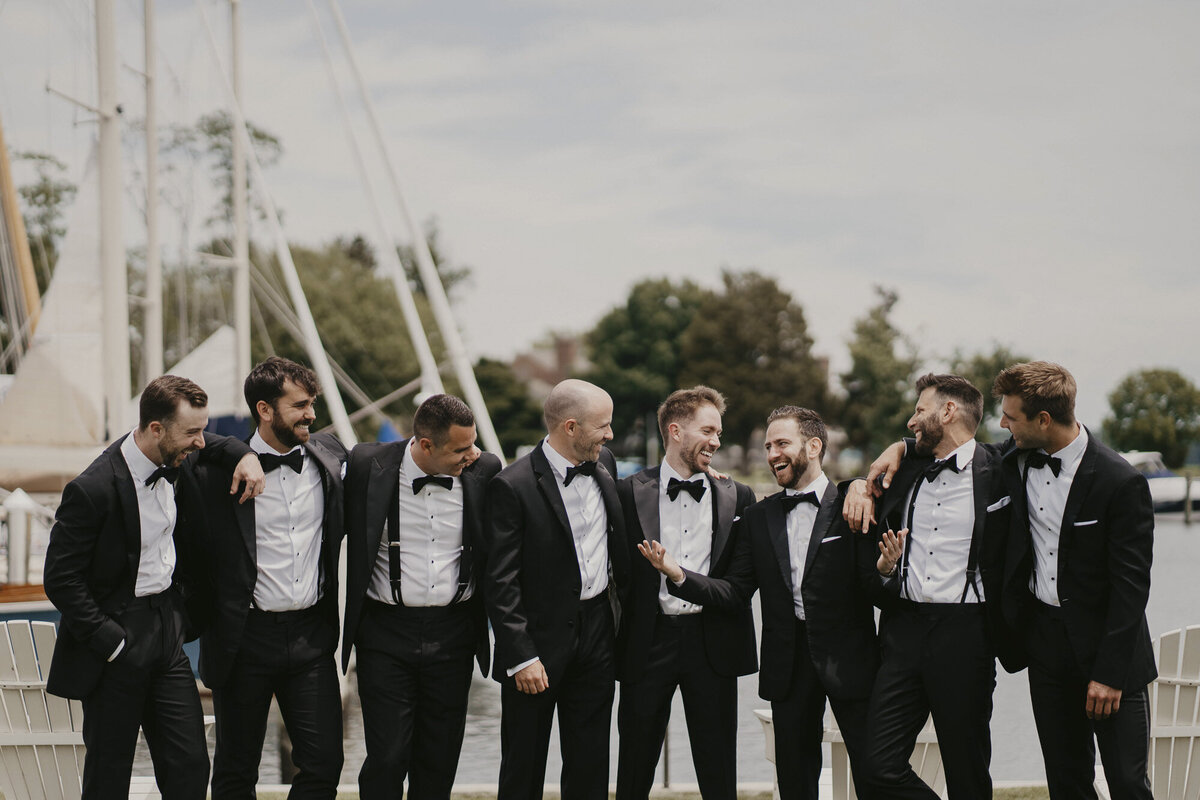 Groomsmen laughing together outside