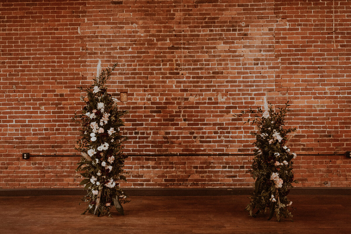 Blush and textured broken arch by Prose Florals