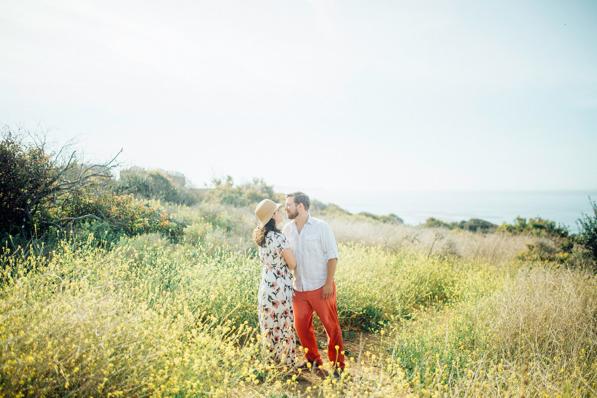 Engagement Photograph Of  Man And Woman In The Middle Of Meadow Los Angeles