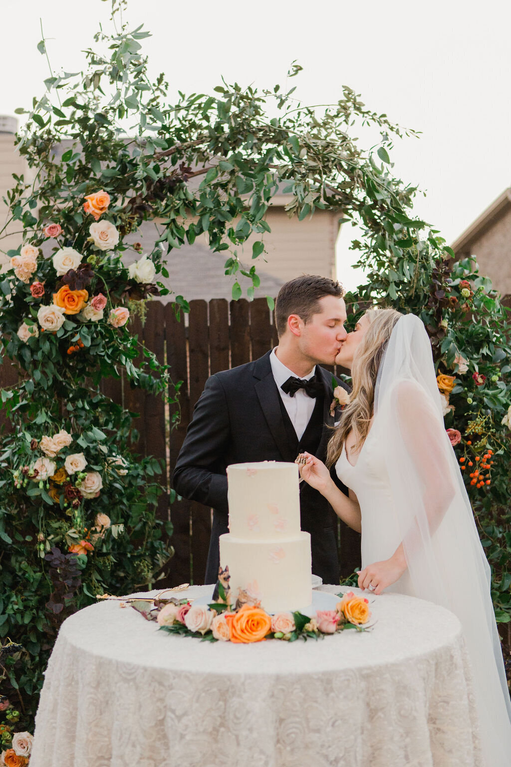 Cake Cutting at Intimate Ceremony in Dallas Forth Worth, Texas with Floral Arch by Vella Nest Floral Design