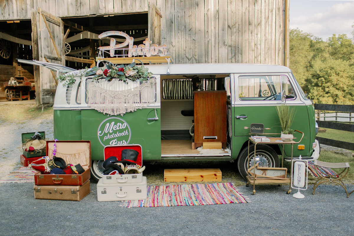 An old school van with props laid out in front of them 