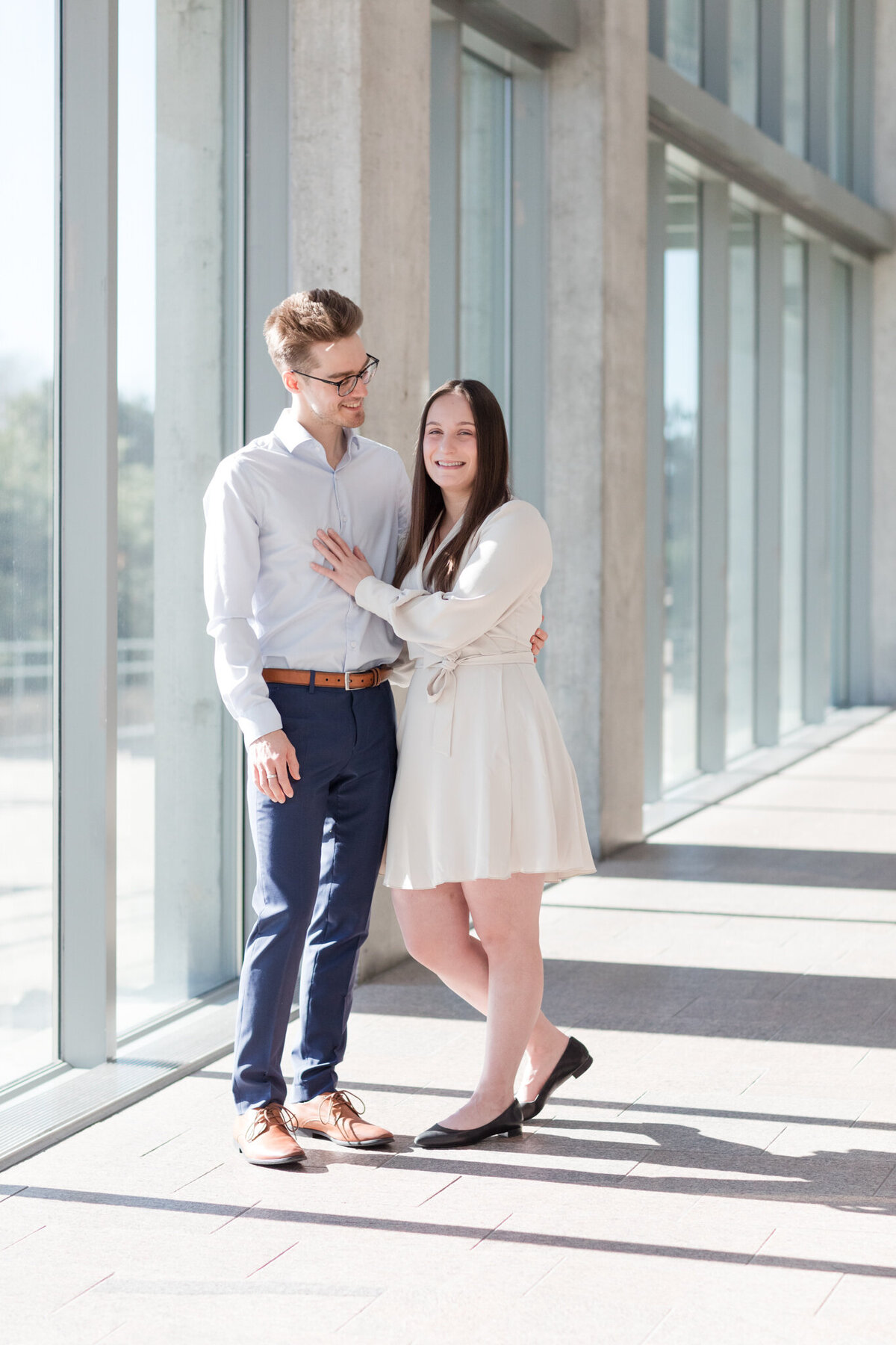 Melissa and Yannick strike a pose in the warm side-lit ambiance of the National Art Gallery, showcasing their love amidst the architectural beauty.