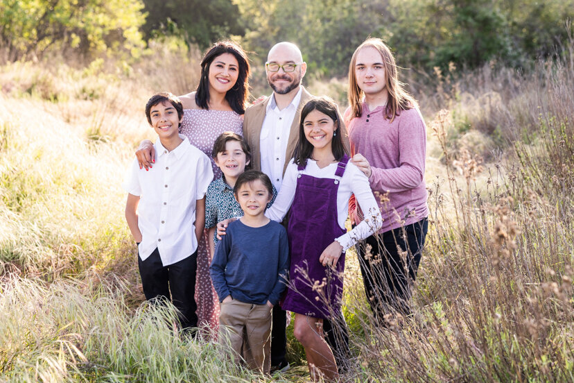 family-of-seven-in-glowy-field--sweetwater-river-bridge-san-diego