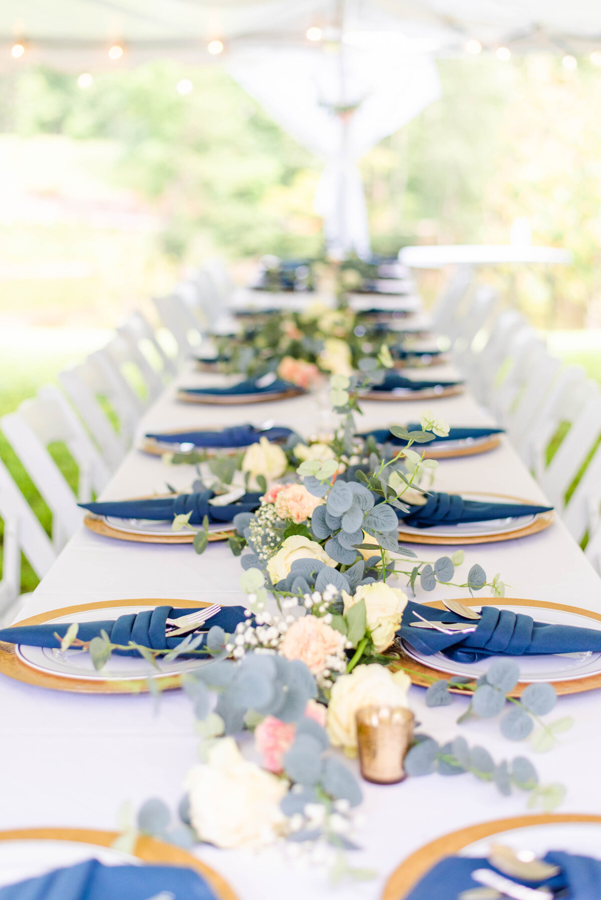elegantly set table for a blue and white themed wedding
