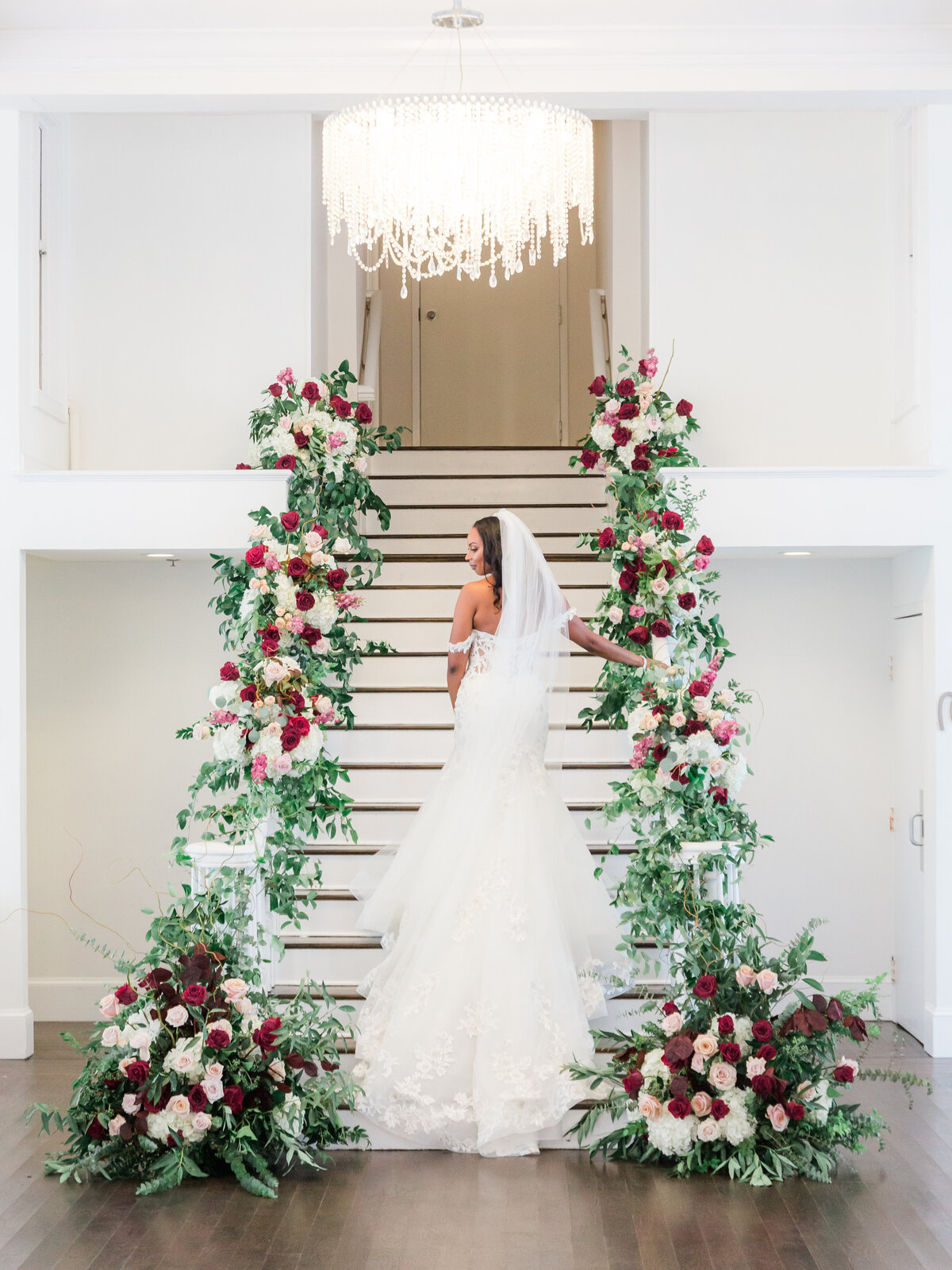 Bride on Belle Mer staircase in Newport, RI