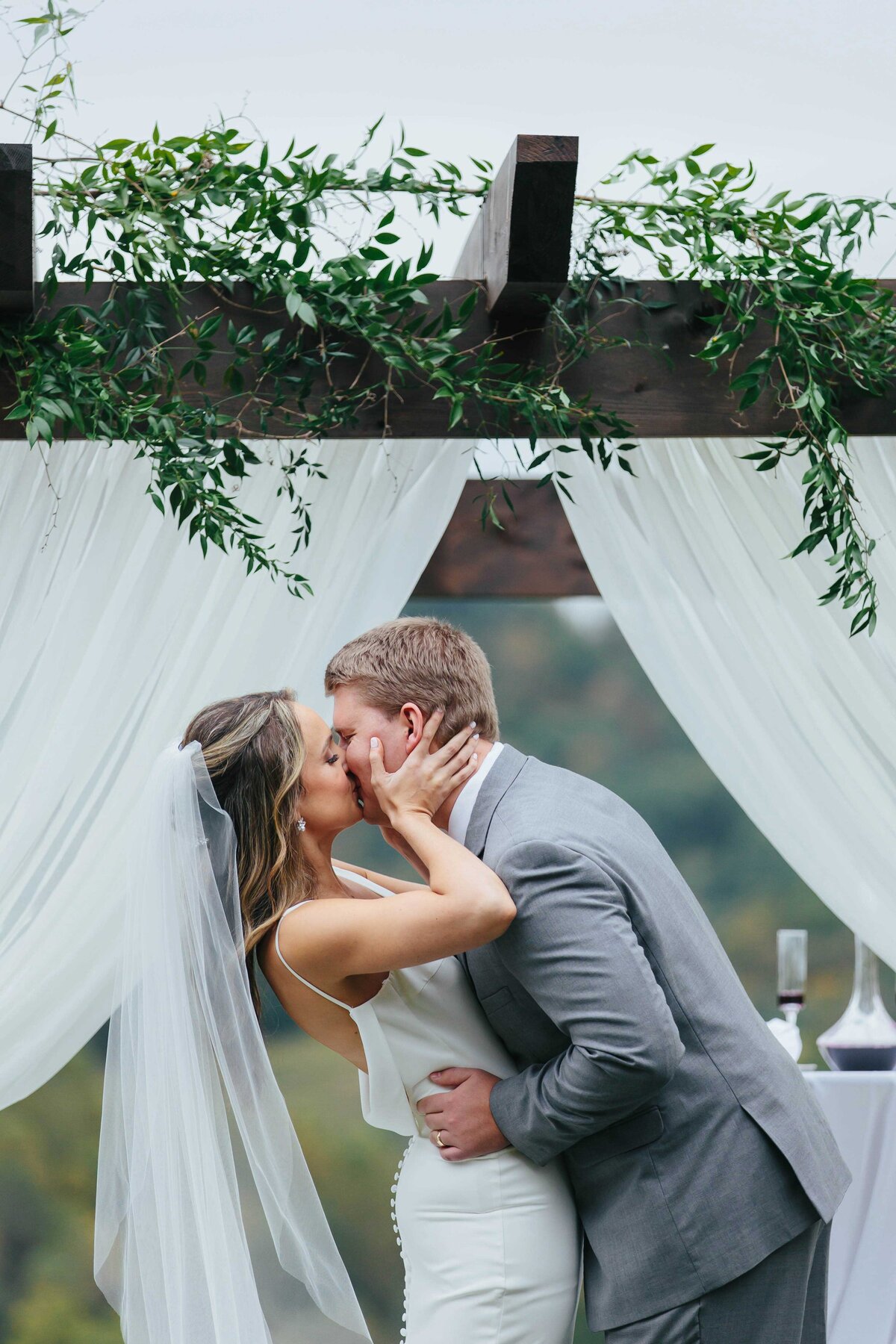 Bride and groom first kiss at chateau selah venue blountville tn