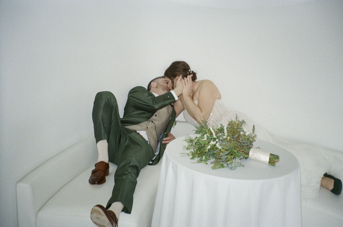 Couple kissing at their wedding shot on 35mm film by Hudson Valley wedding photographers