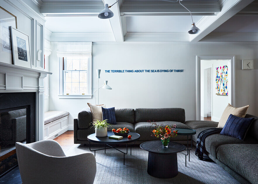 A Boston decorator blends modern family room interior design with traditional home details, creating a warm yet contemporary living space.