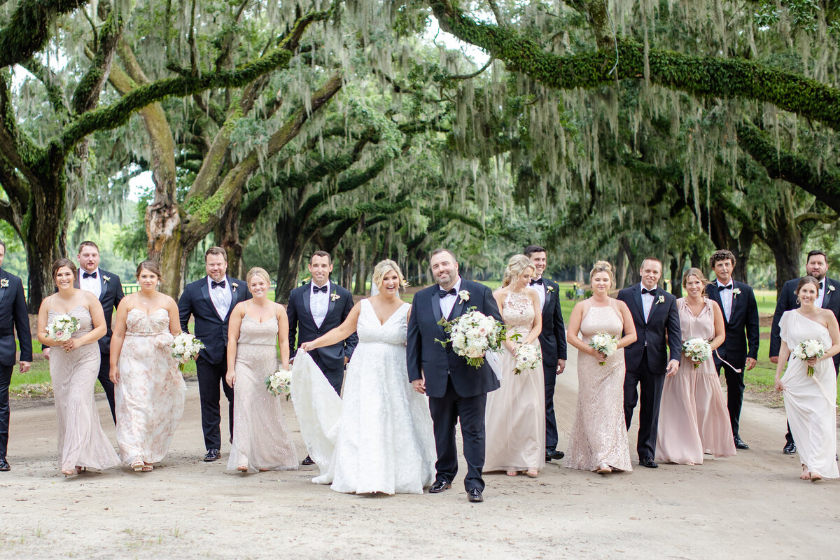 Florida wedding party celebrates by Riley James.