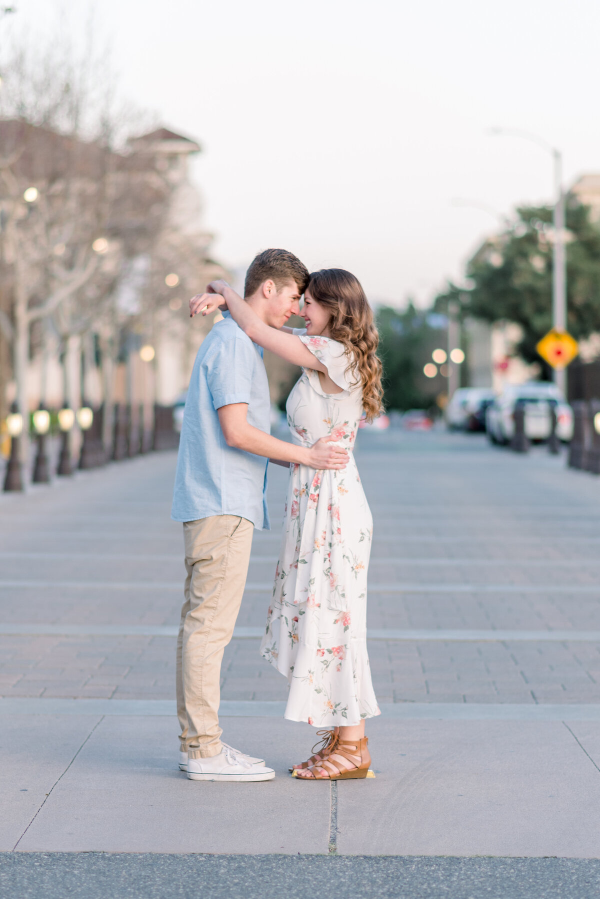 couple in the middle of the street looking at eachother eyes