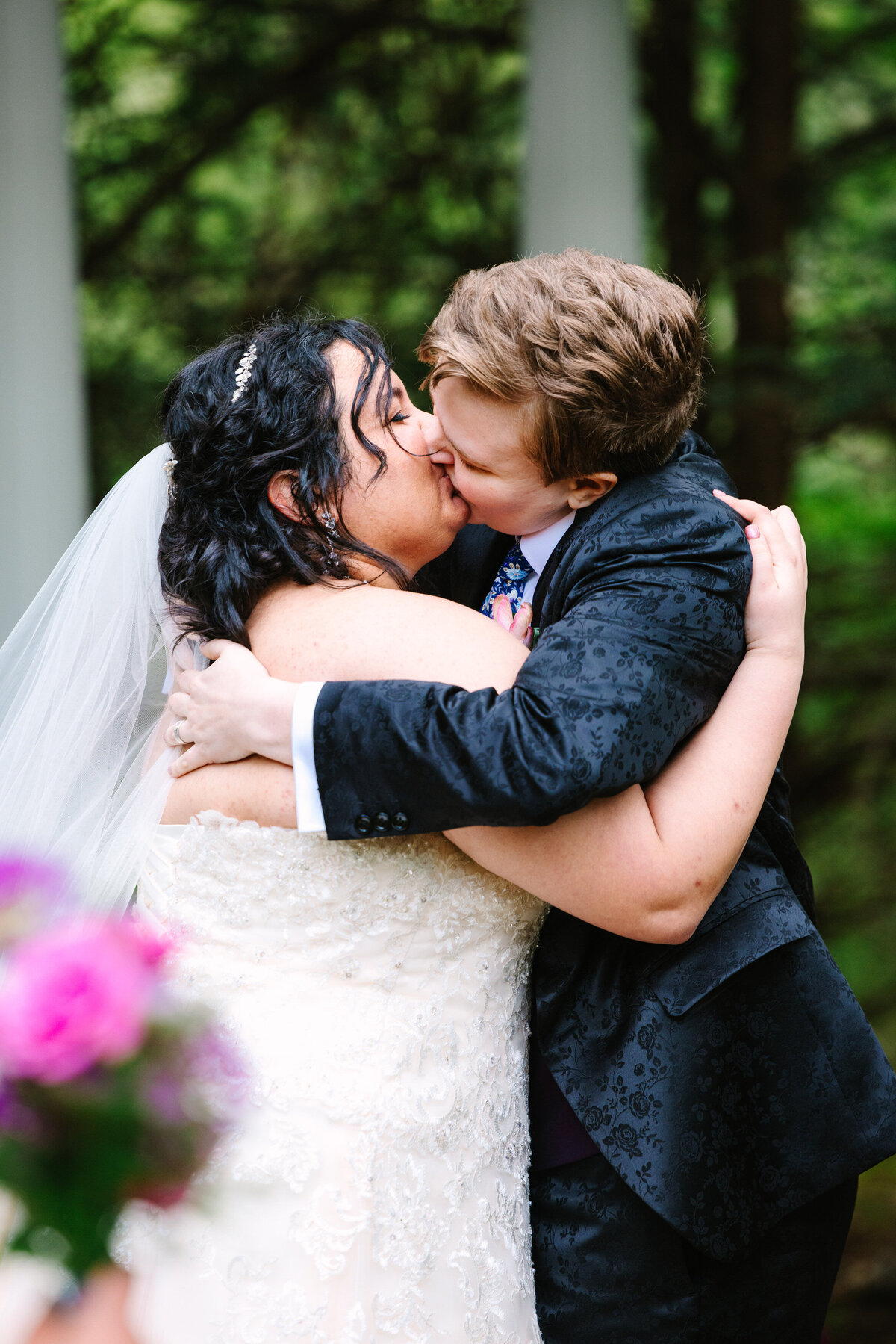 Two brides sharing their "You may kiss the bride" moment
