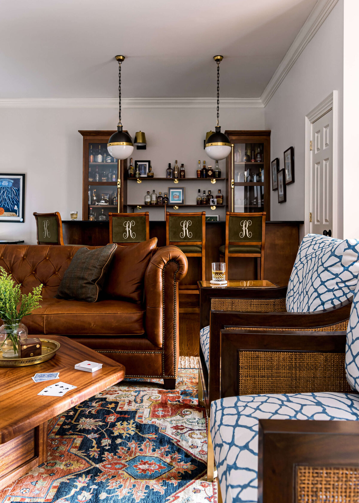 sweet southern home windmill brown leather couch and wicker chairs in living room