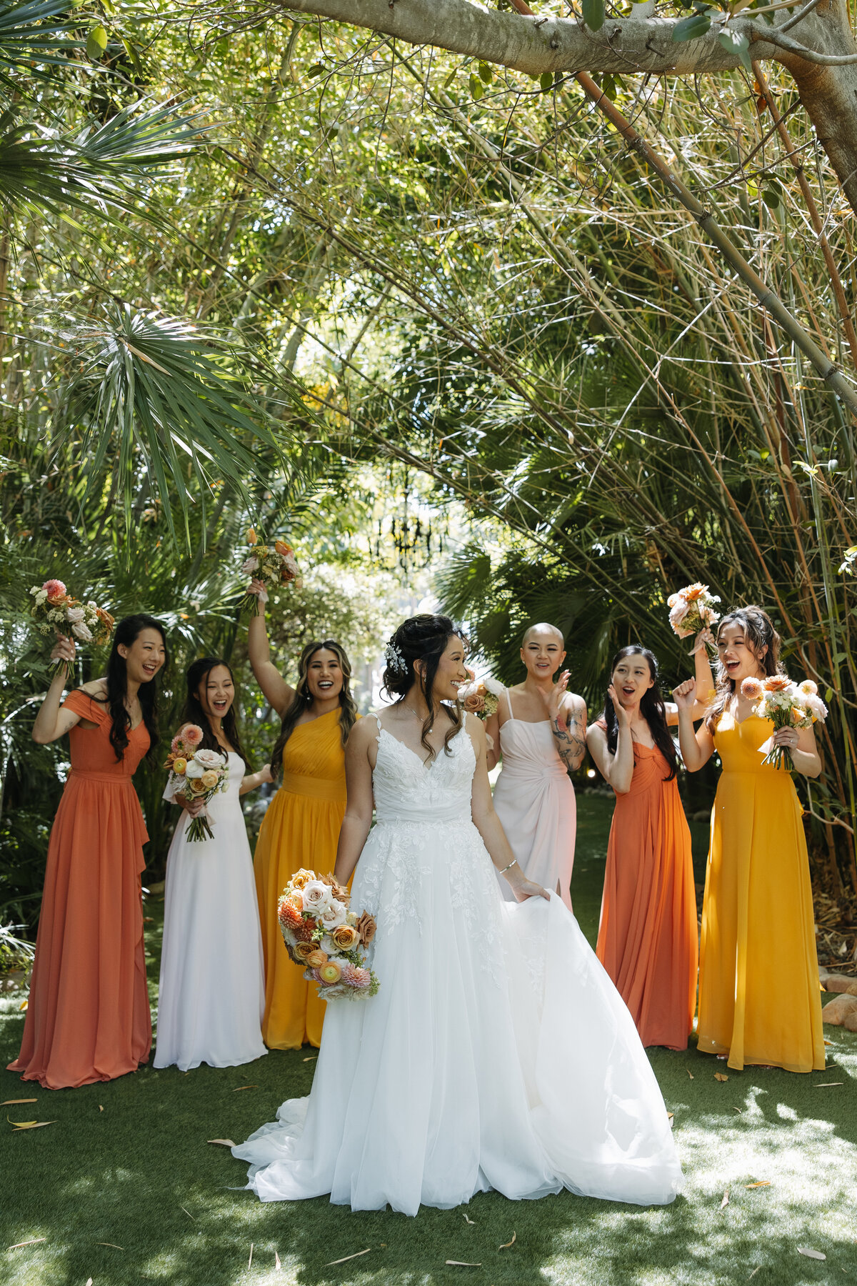 bride and bridesmaids walking, botanica wedding 