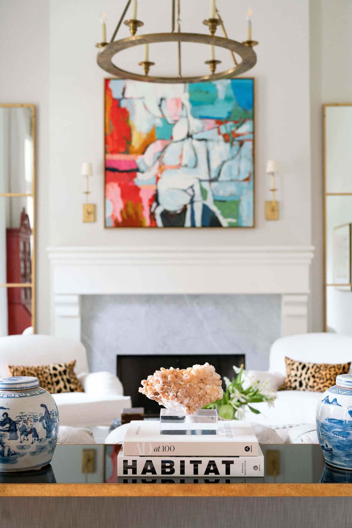 oyster creek studios heathcott abstract painting and round light fixture in living room