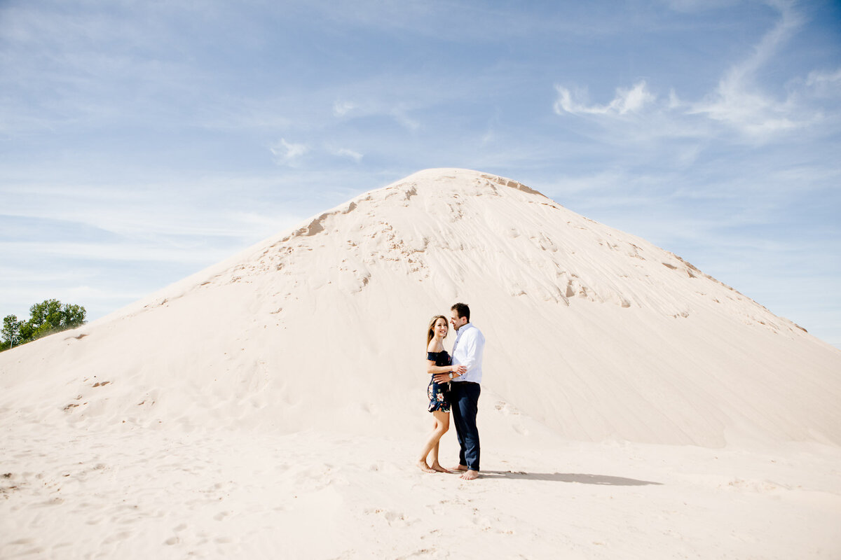 Engaged couple embracing in Buffalo Outer Harbour, New York