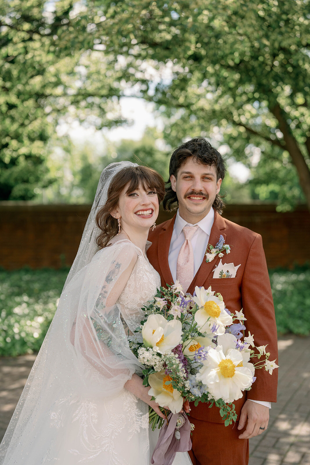 Candid bride and groom moment during May wedding in West Michigan