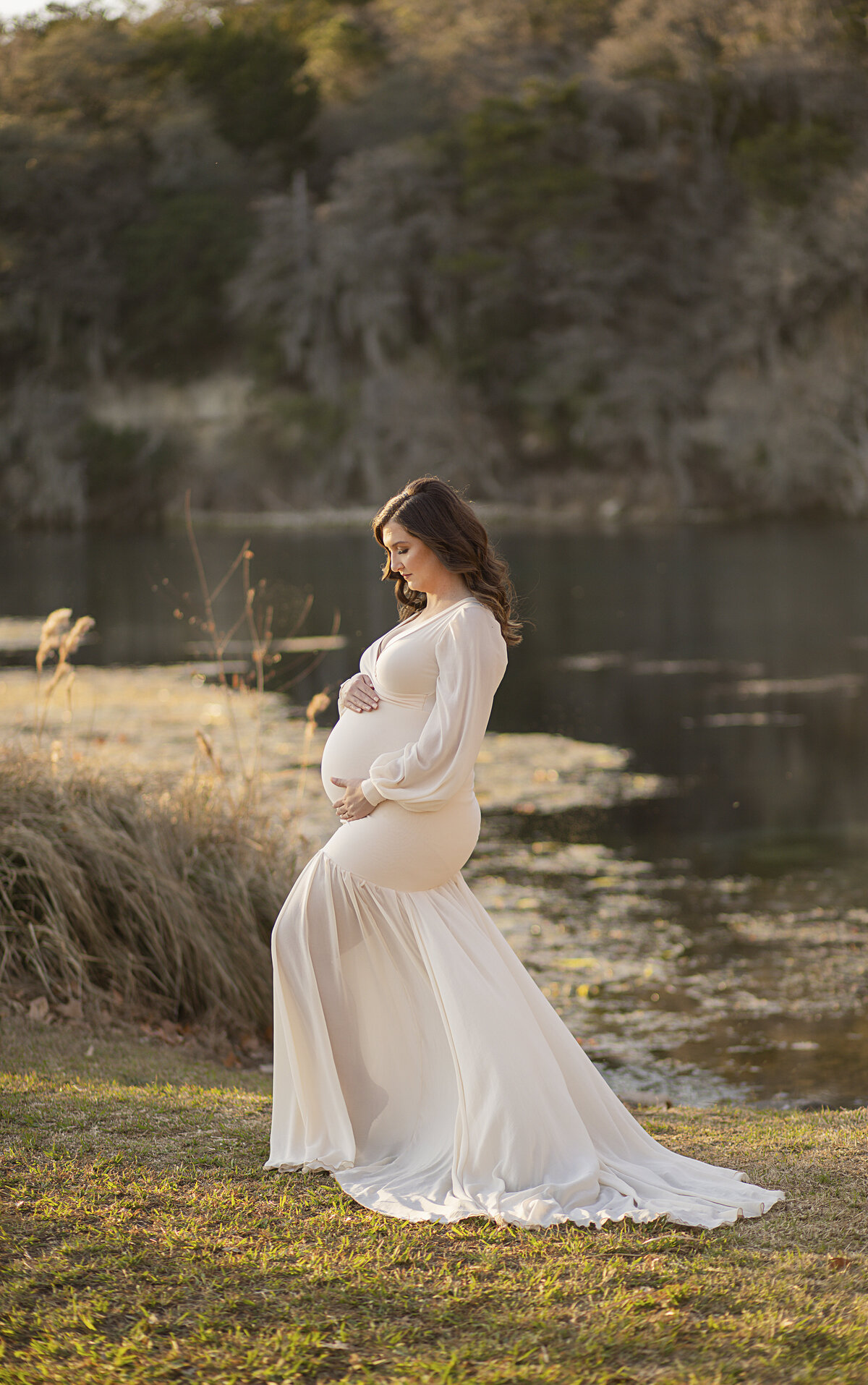 mother holding belly outside