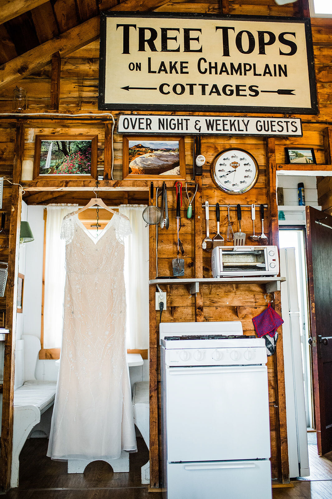 wedding dress hanging at treetops lodge in south hero at lake champlain vermont farm wedding