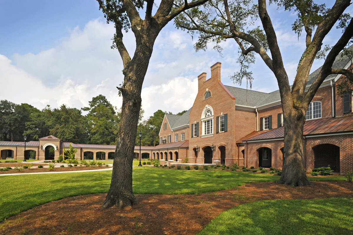 view across the front lawn at Savannah Country Day School with covered breezeway beyond