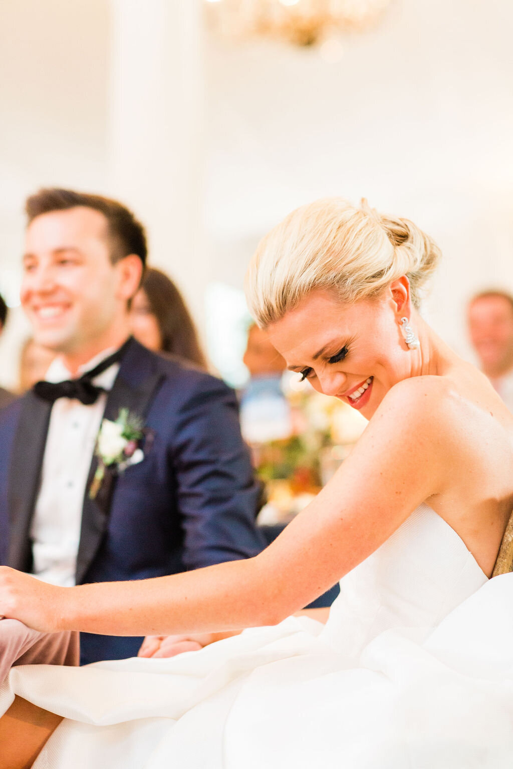 bride and groom reception laughing