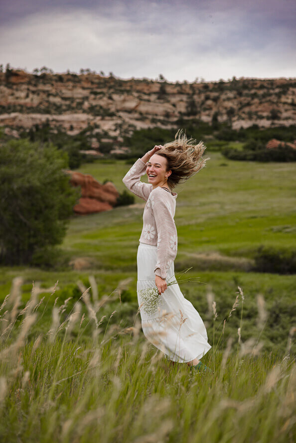 Girl dances in the wind out at South Valley Park.