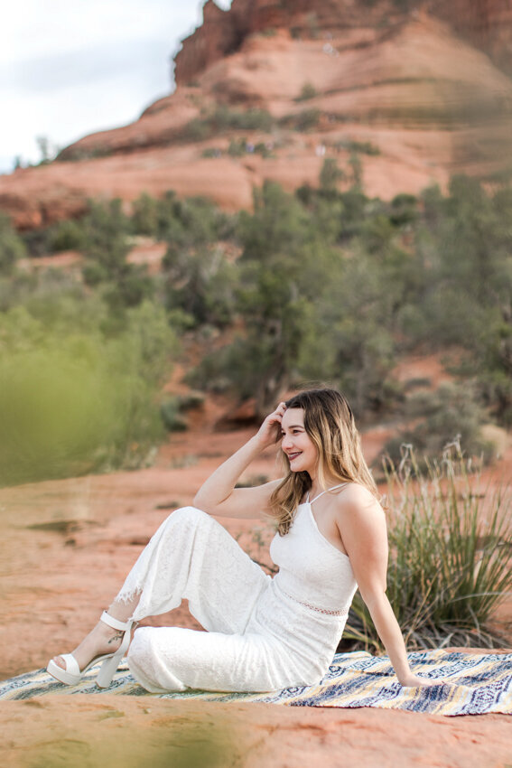 Senior girl sitting on rocks in Sedona destination session