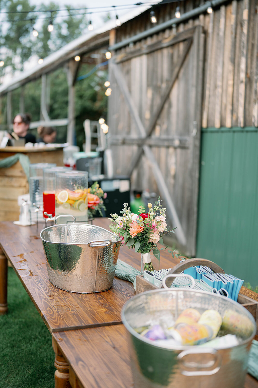 Bright and colorful signature wedding drinks displayed on the table during a fall reception at The Cherry Barn at Nugent Orchards.