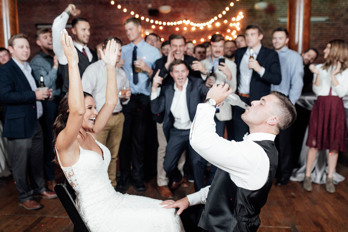 Bride and groom dancing at reception. 
