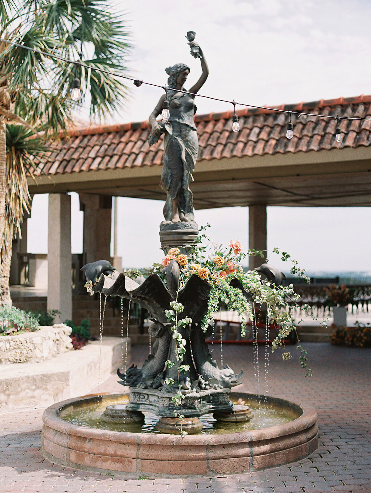 The statued fountain was decorated with flowers and fresh fruit for this couple's wedding