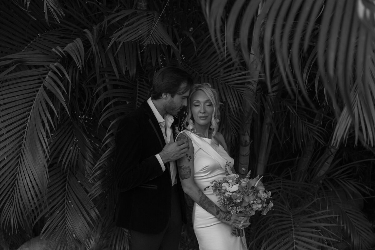 groom embraces bride after elopement in costa rica