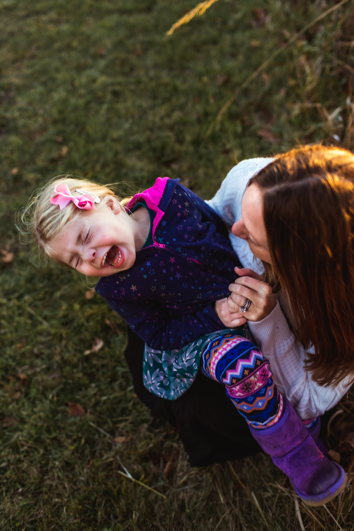 Laughing with mommy during golden hour.