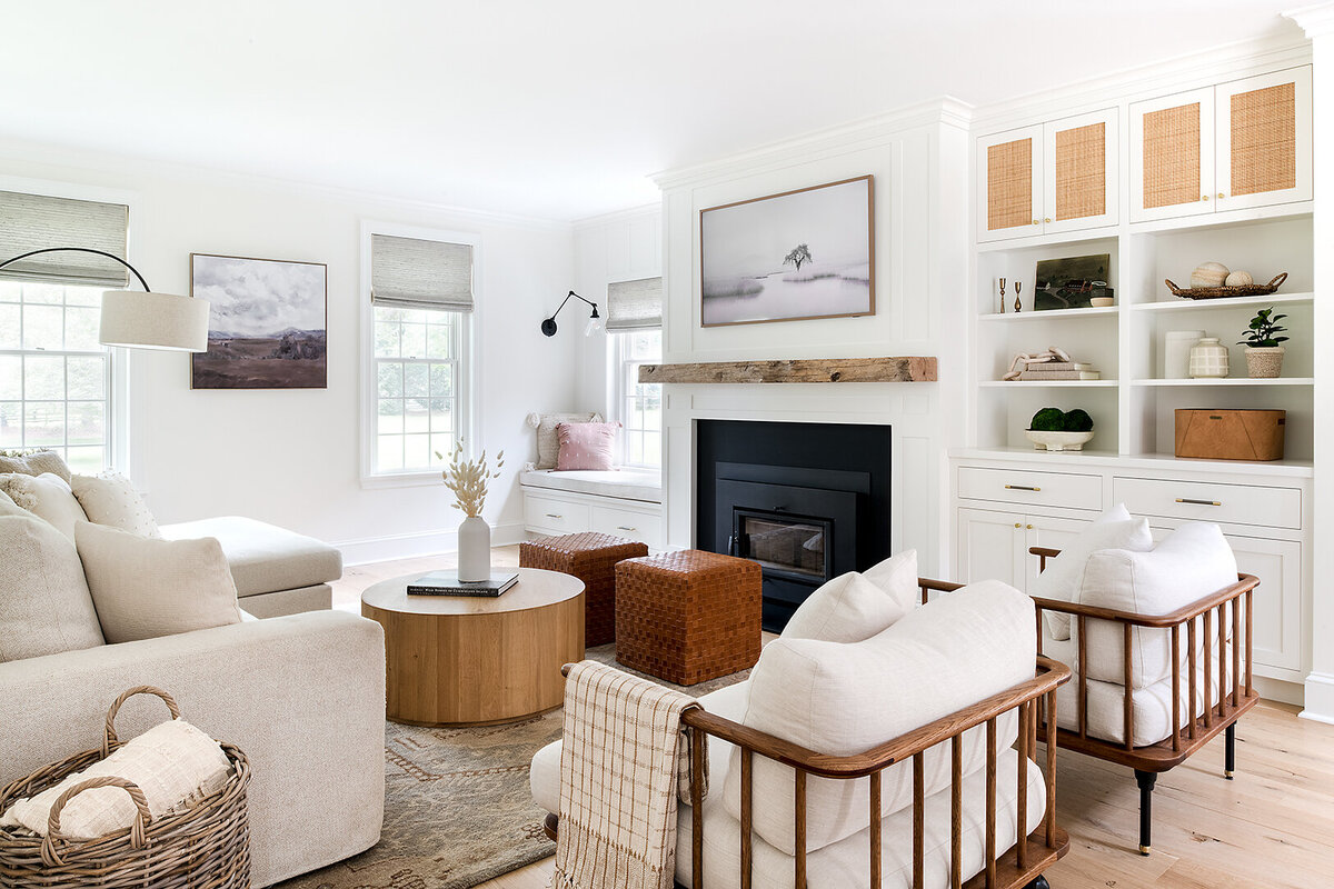 white living room with fireplace and warm neutral accents