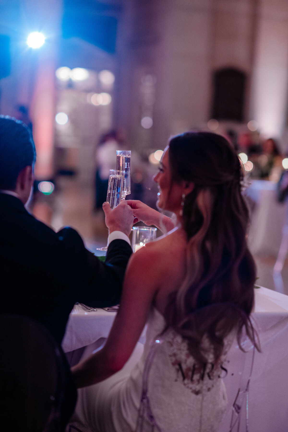 Bride and groom toast during their reception 