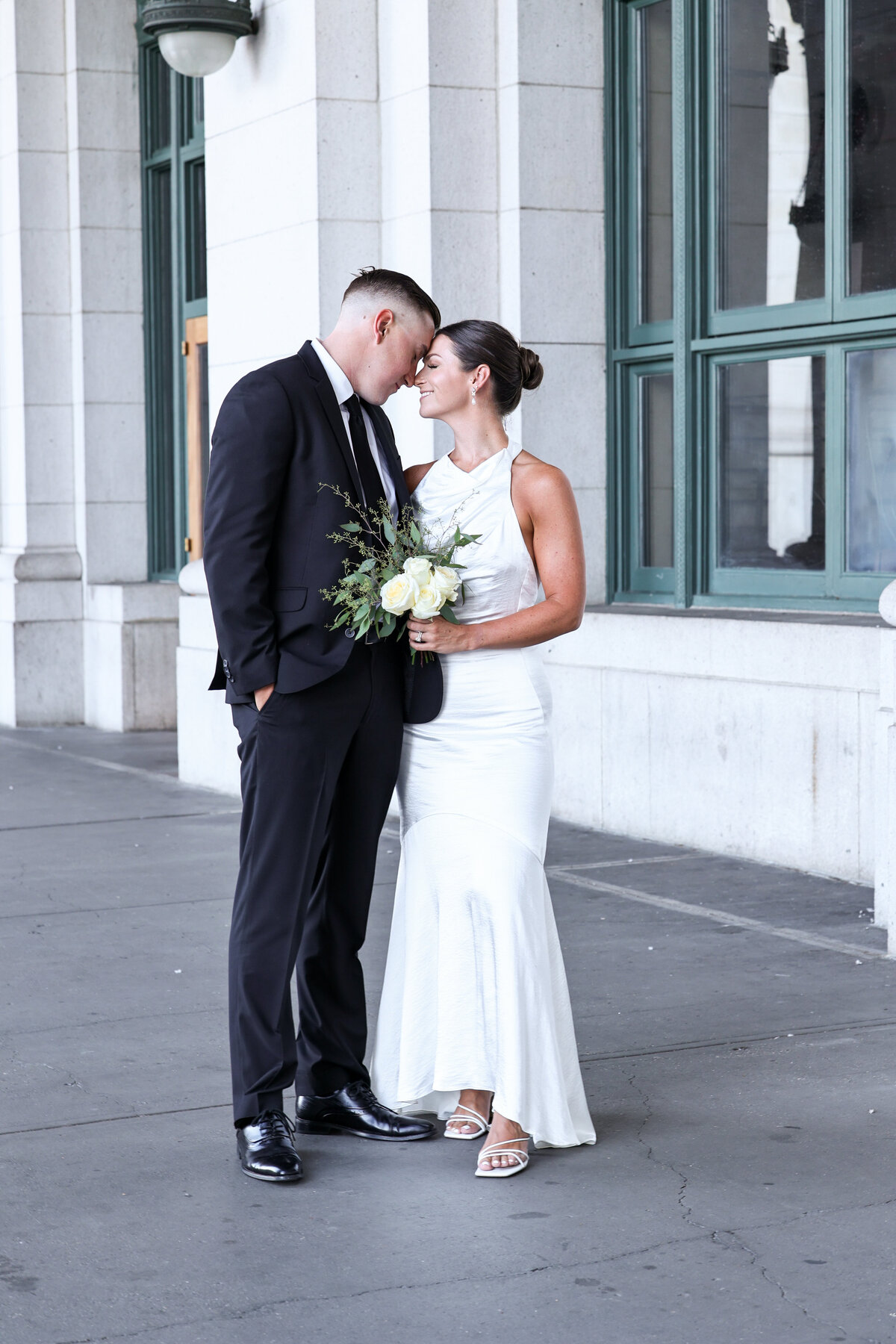 bride and groom hugging during their elopement at Union Station in Washington DC by destination wedding photographer Amanda Richardson Photography