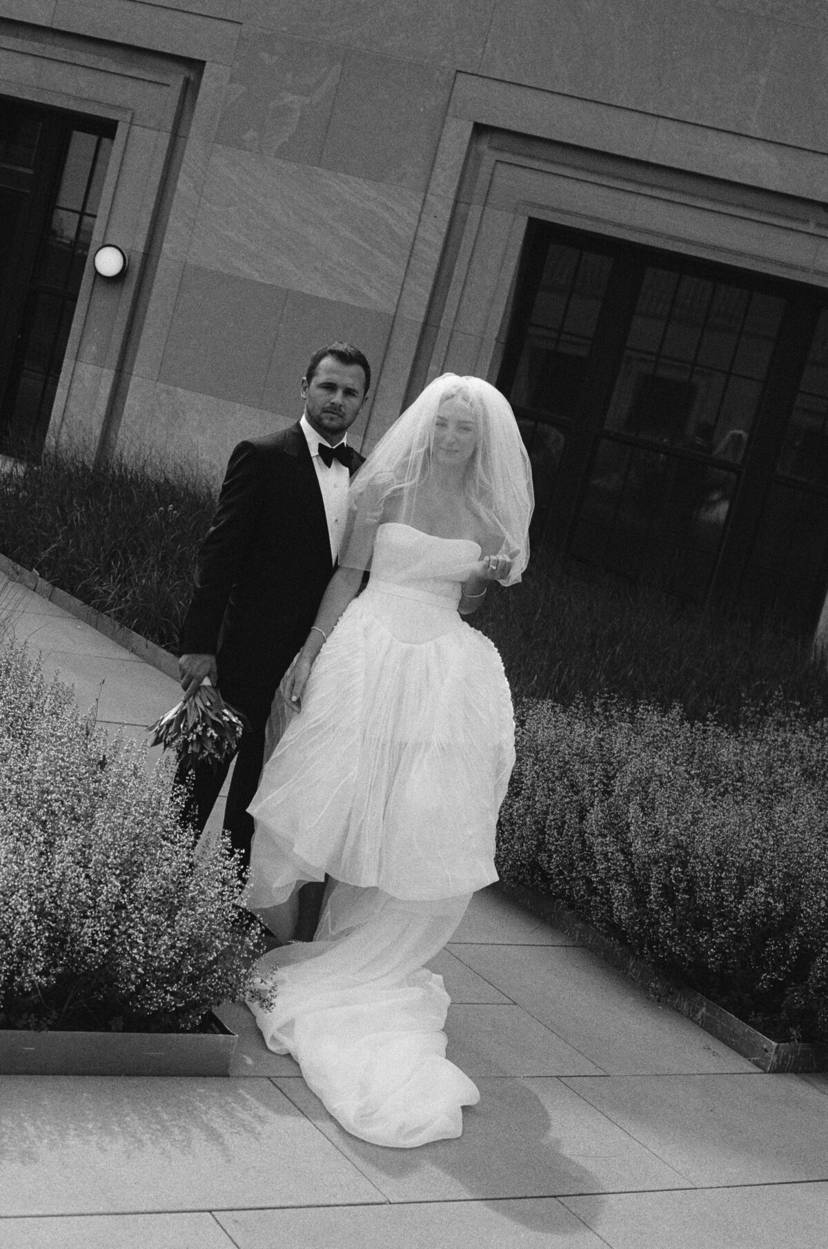 Fashion forward editorial wedding photography captures ceremony moments at Old Post Office Chicago, showcasing Lauren Alatriste's sophisticated approach combining architectural beauty with magazine-worthy aesthetics and authentic wedding day emotion.