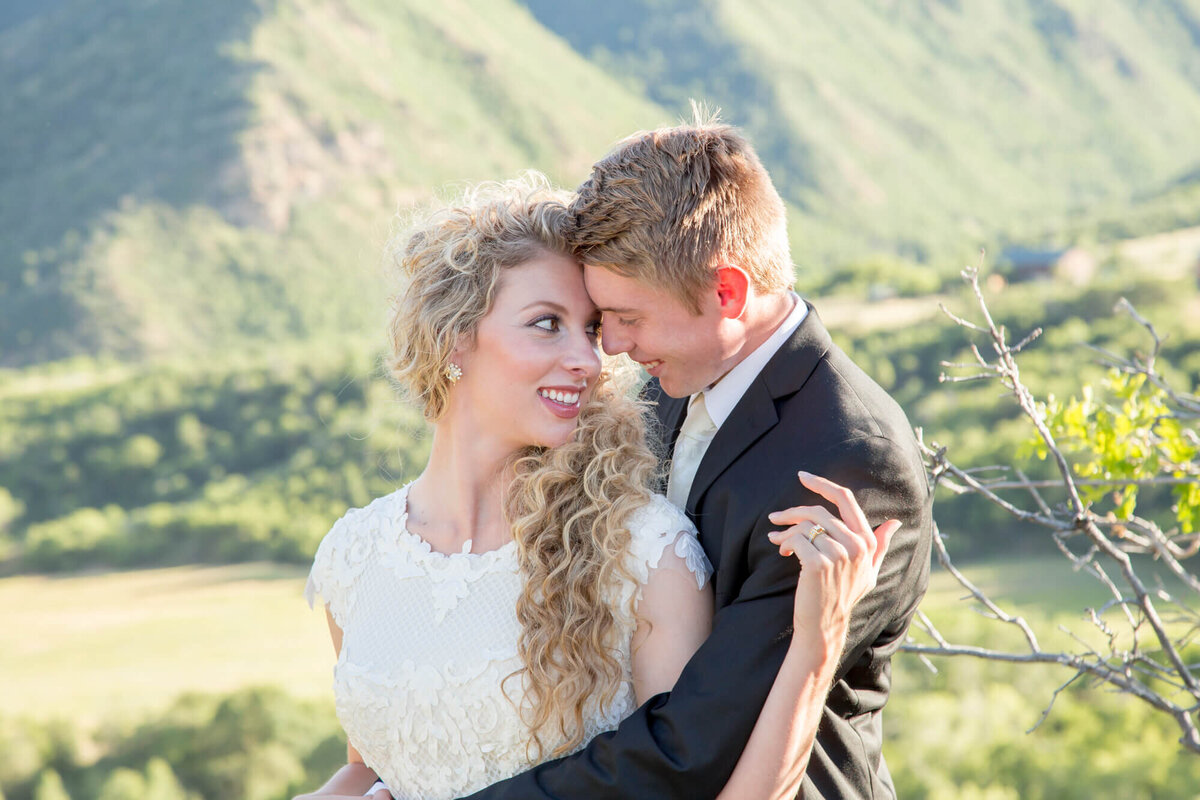 a bride looking back and smiling at a groom