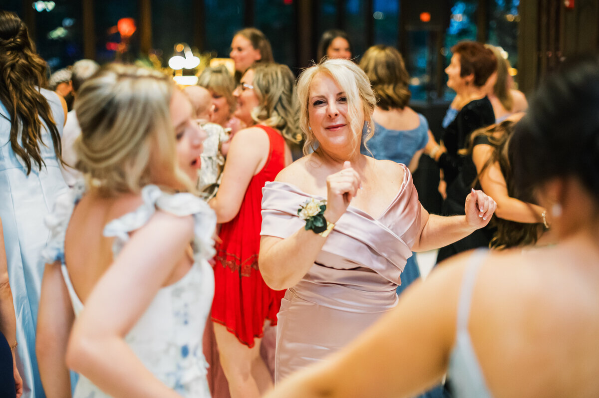 Wedding guests dancing and celebrating during the reception at Old Edwards Inn in Highlands, North Carolina.