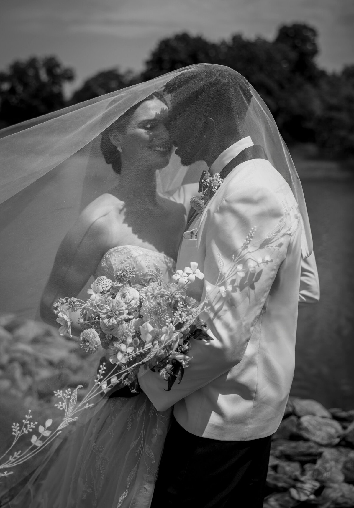 veil-covering-jubilant-bride-and-groom