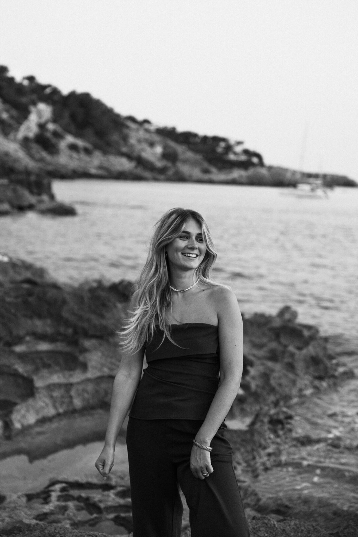 Woman is posing and laughing for a personal branding photoshoot in Ibiza