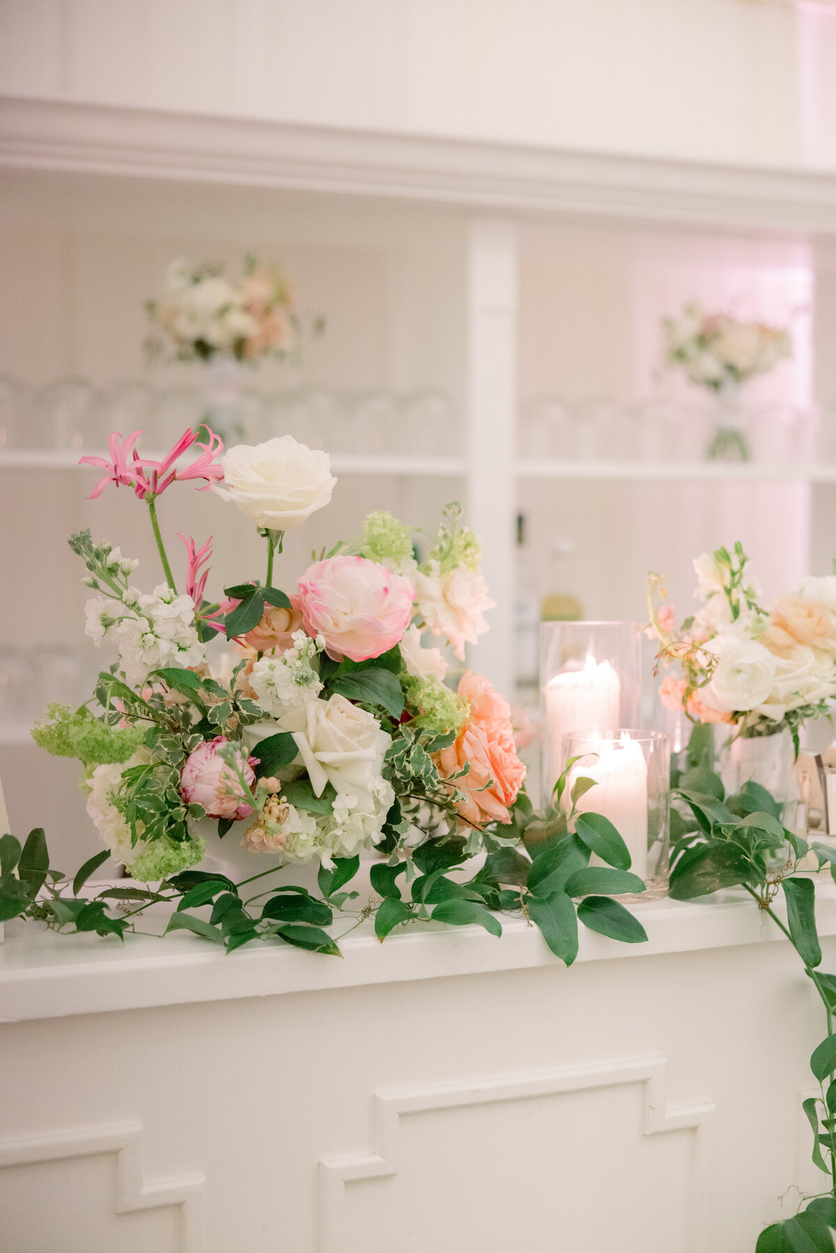 elevate-cocktail-hour-with-a-bespoke-bar-adorned-with-romantic-blush-florals-and-lush-greenery